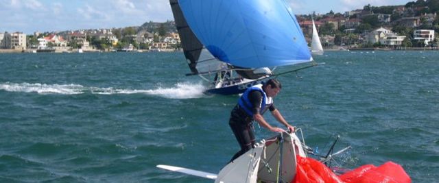 12-foot skiffs - one charging, one capsized...