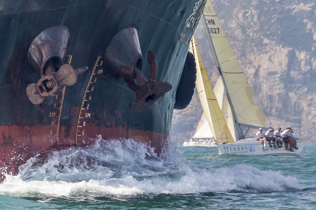 A tanker charges past the China Cup fleet