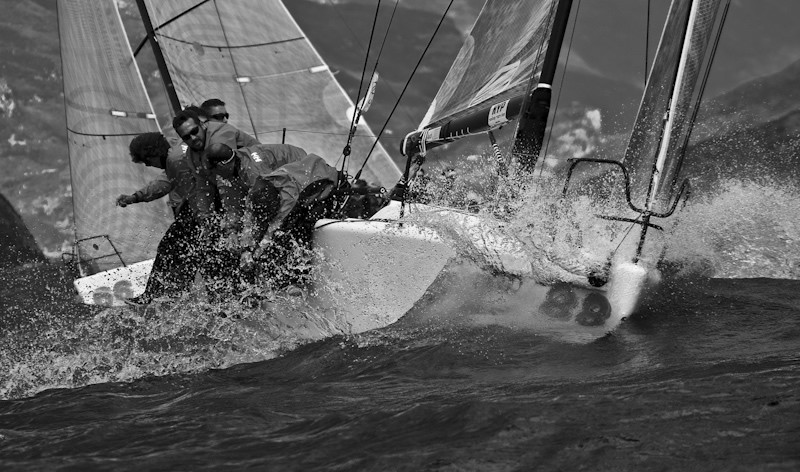 Melges 32 fleet battling upwind at Lake Garda