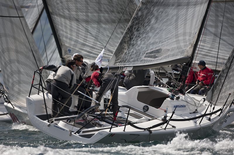 Melges 32 fleet battling upwind at Lake Garda